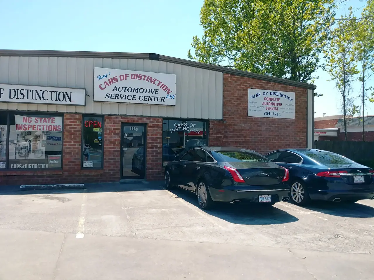The Ray's Cars of Distinction storefront with its Automotive Service Center sign and NC State Inspections banner